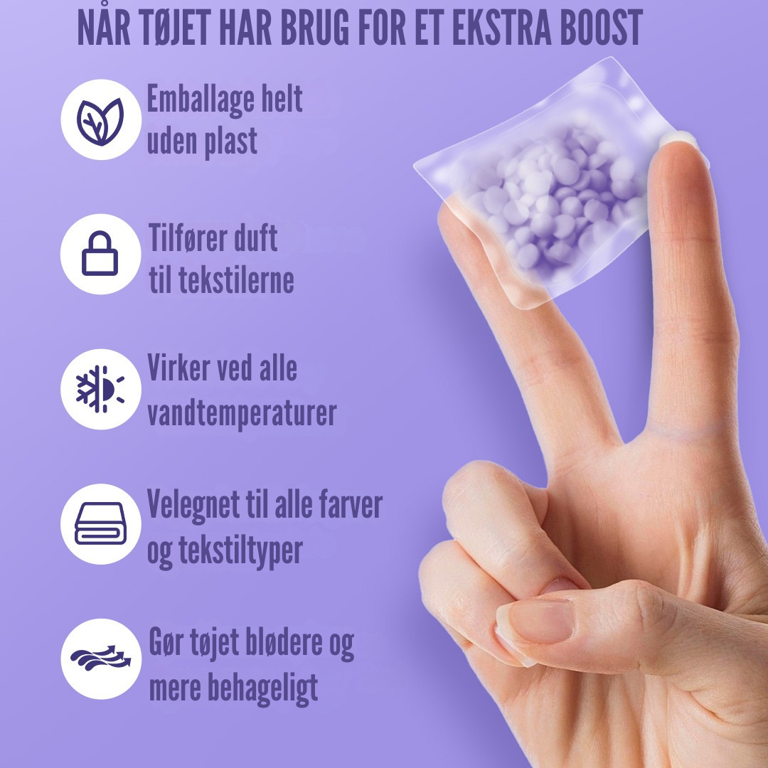 Pod placeret mellem tøj i vaskemaskine