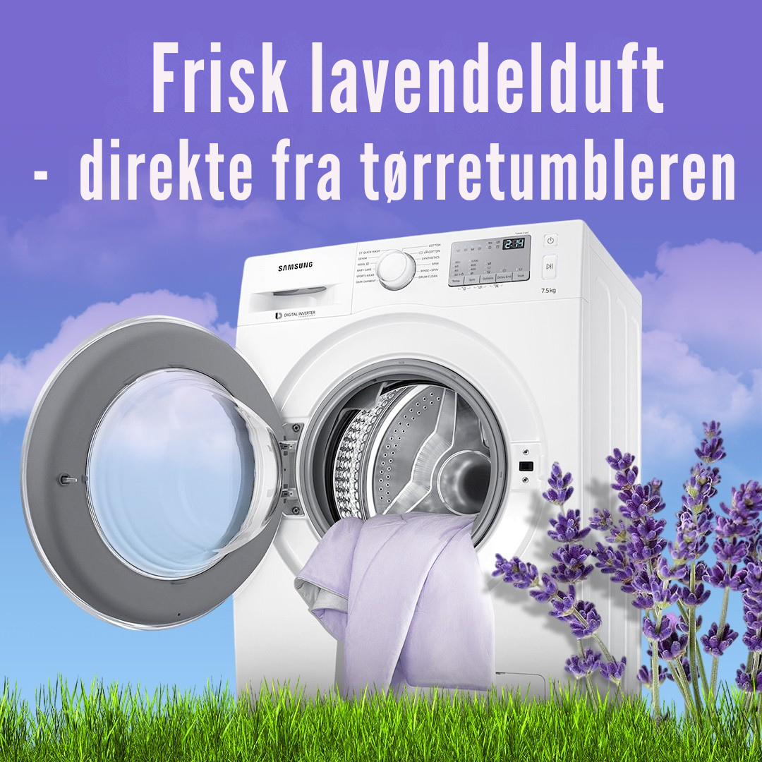 Tørreark lagt i tørretumbler blandt tøj